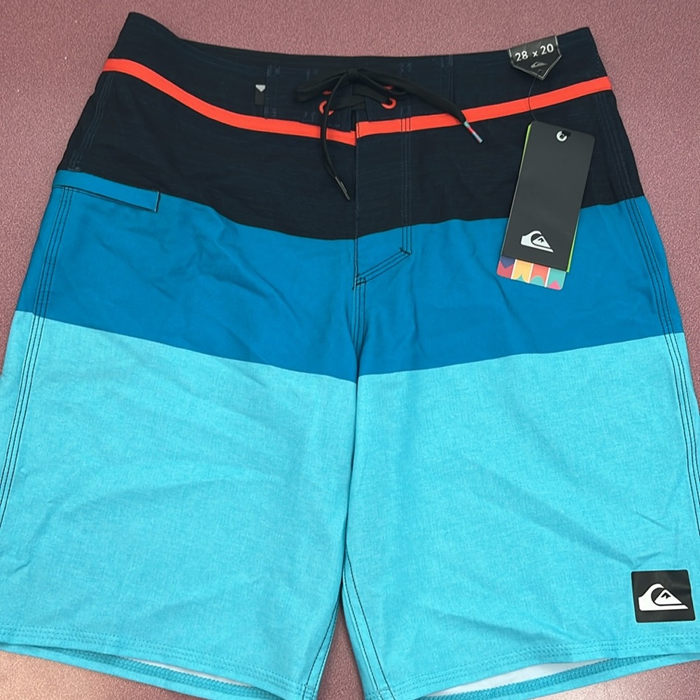 Quicksilver board shorts. Three shades of blue. Velcro & drawstring closure. NWT